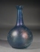 Early Roman blue glass unguentarium (cosmetic flask).