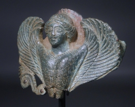 Classical Greek bronze siren. (Hydria handle appliqu???�).