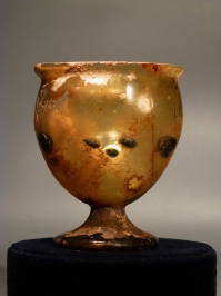 Roman yellowish green glass goblet.