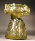 Roman olive green glass sprinkler with decorative handles around rim.