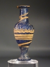 Hellenistic core-formed blue glass spindle-shaped unguentarium.
